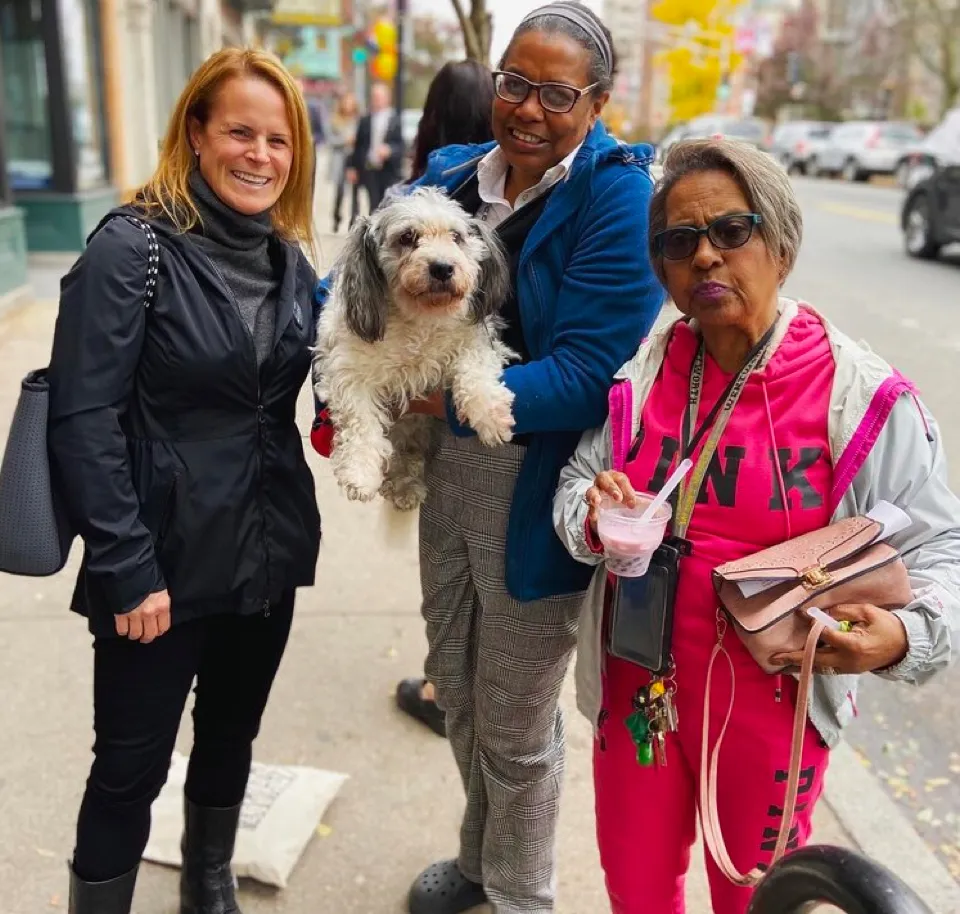 Jennifer Nassour posing with supporters on the street